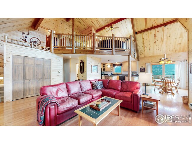 Beamed ceilings and log accents.