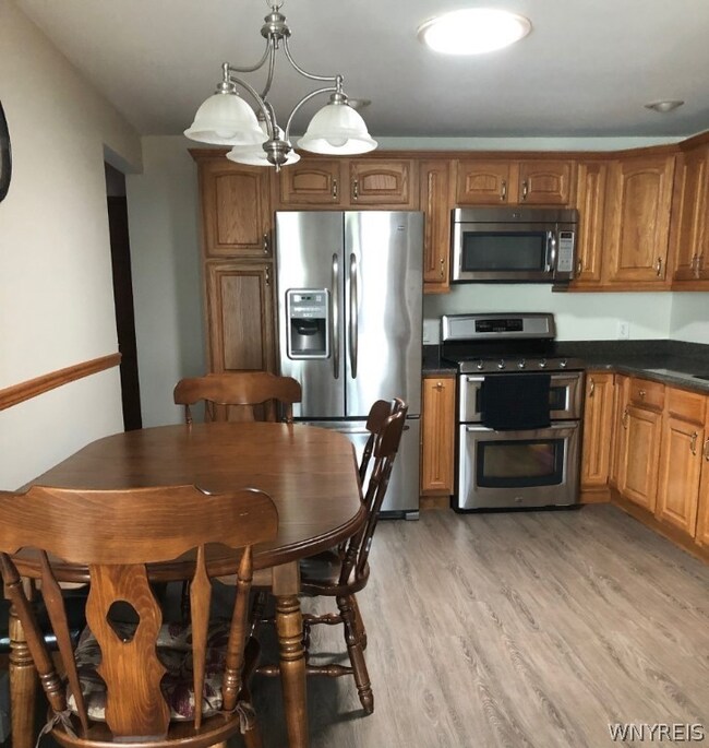 Kitchen with updated floor granite counter, all appliances stay
