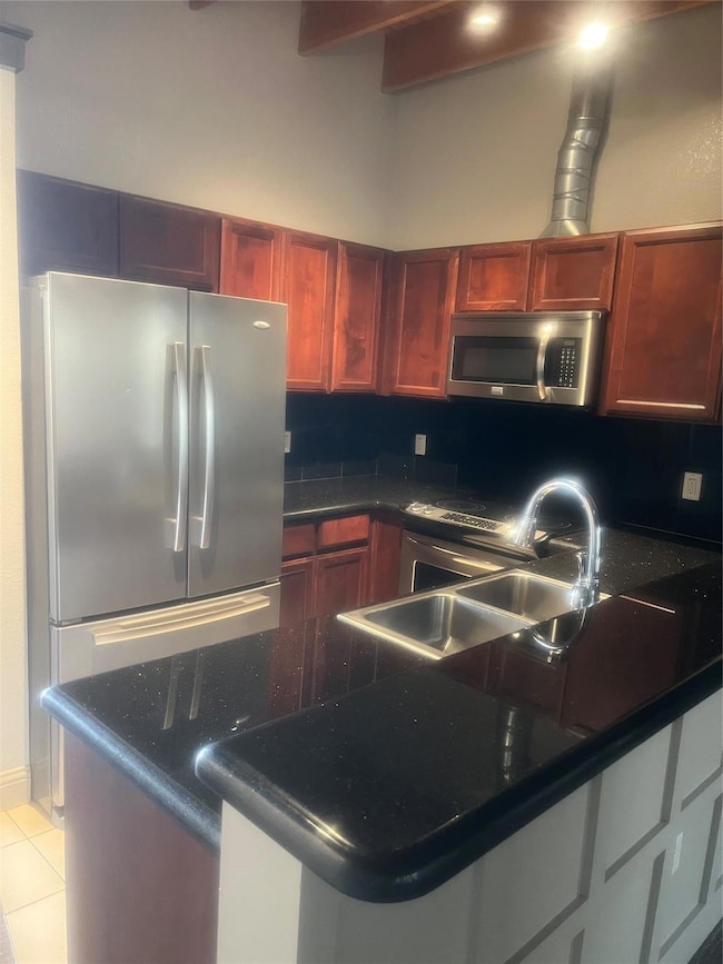 Kitchen with stainless steel fridge, refrigerator,