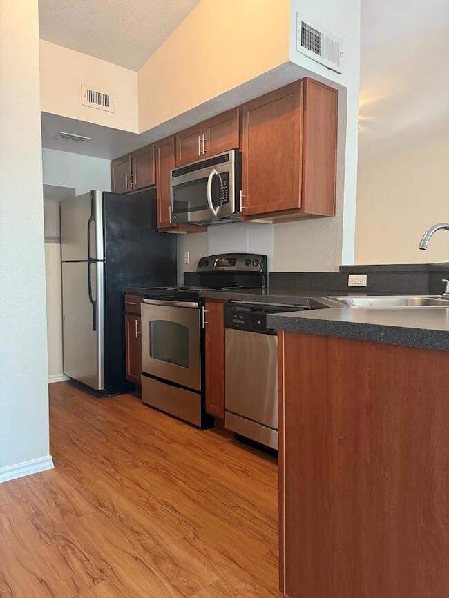 Kitchen featuring appliances with stainless steel