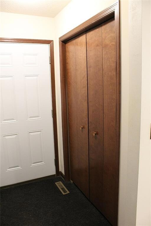 Door to the garage and closet in laundry area.