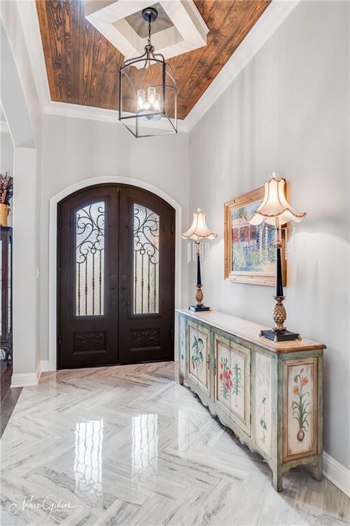 The foyer’s marble herringbone patterned flooring 