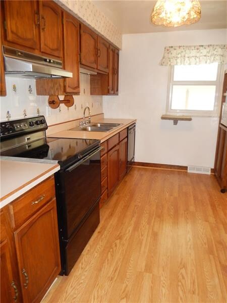 Super fully equipped kitchen with hard wood floors