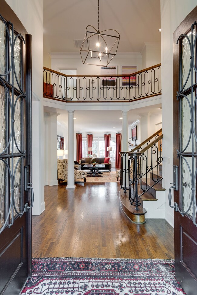 Lovely foyer with extra high ceilings and open to the living and formal living room