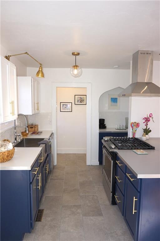 Open Kitchen with Navy base cabinets, White upper 