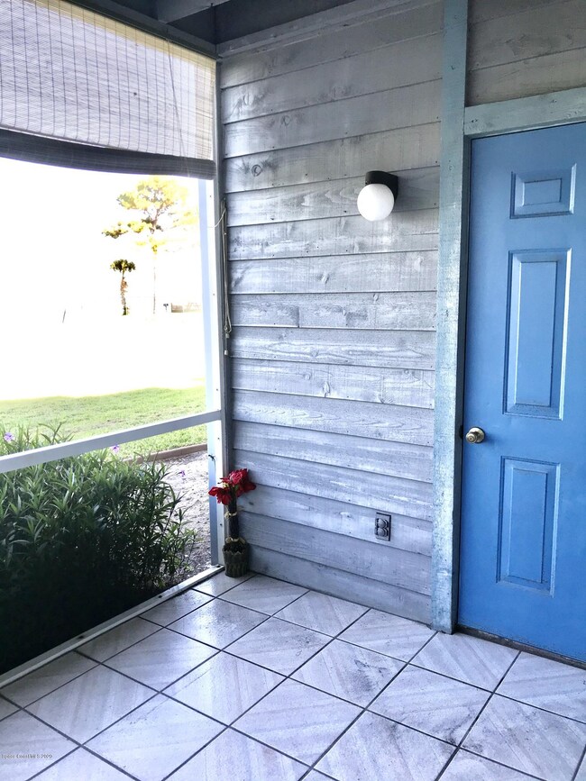 Screened patio with storage room