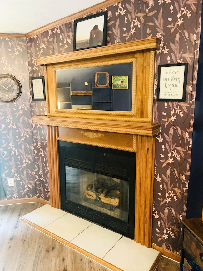 Detailed view of wallpapered walls, wood finished 