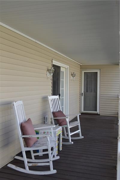 Front covered porch is very spacious and is access