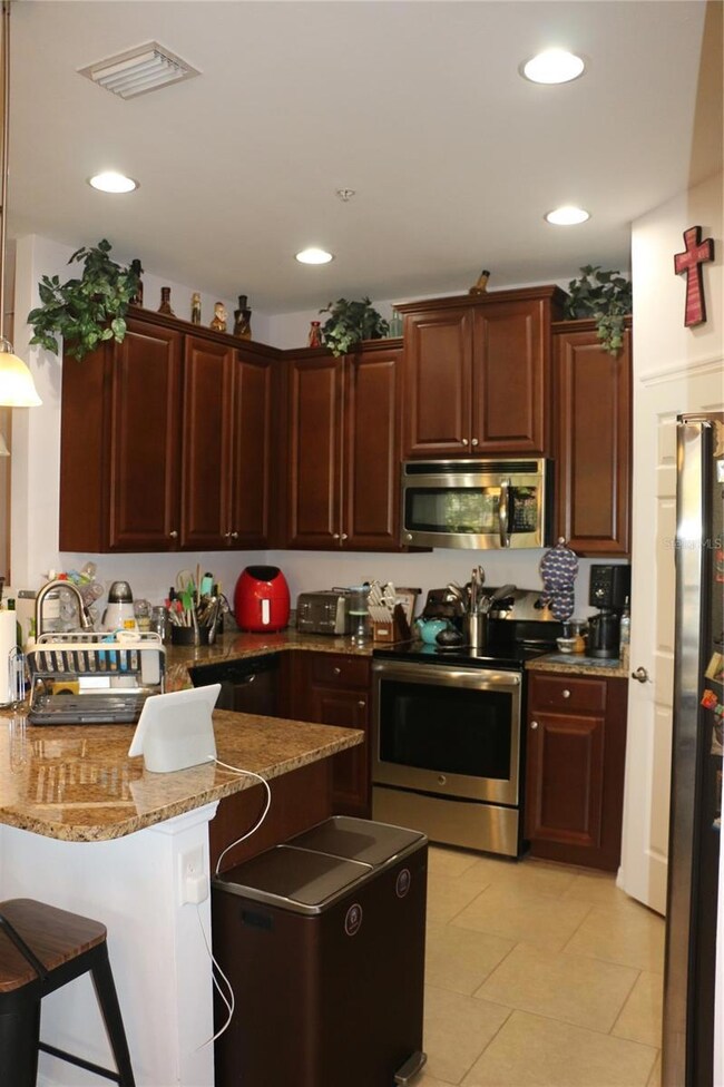 Kitchen with good quality cabinets and granite countertops.