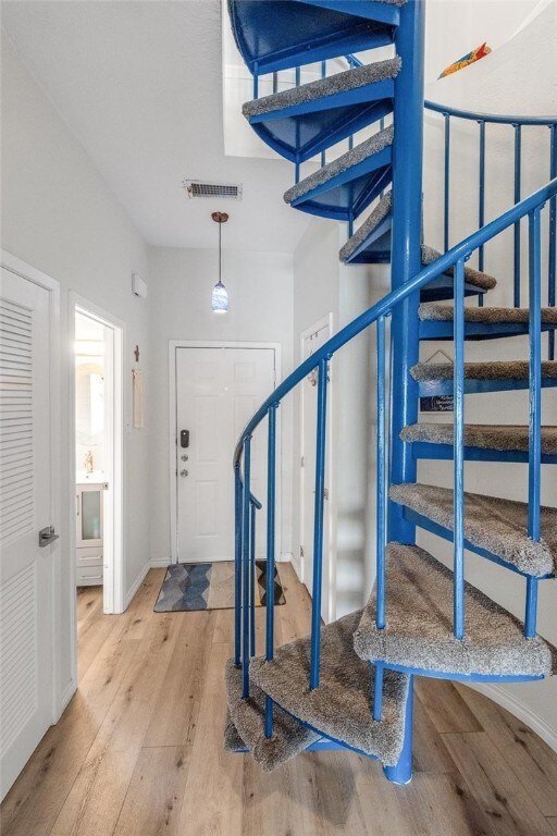 Front door entry into this cute 2-story condo. Spi