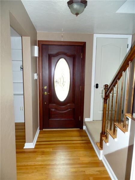 Inviting entryway with spacious coat closest.