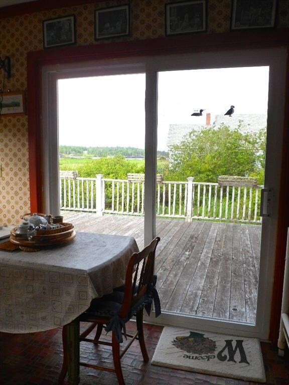 West facing deck off kitchen has...