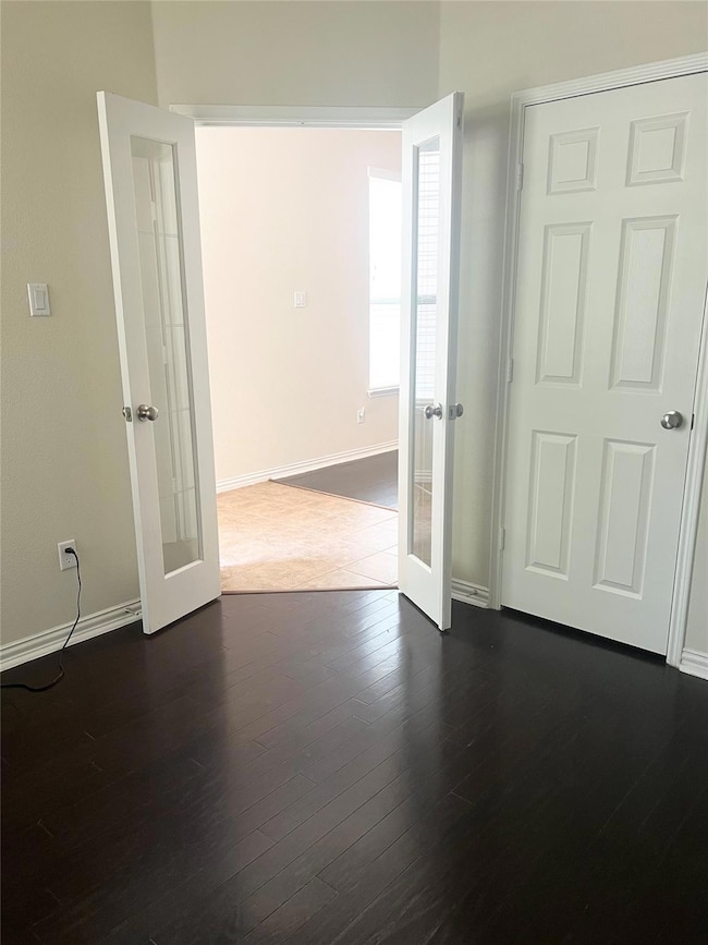 Living room featuring wood-type flooring and base