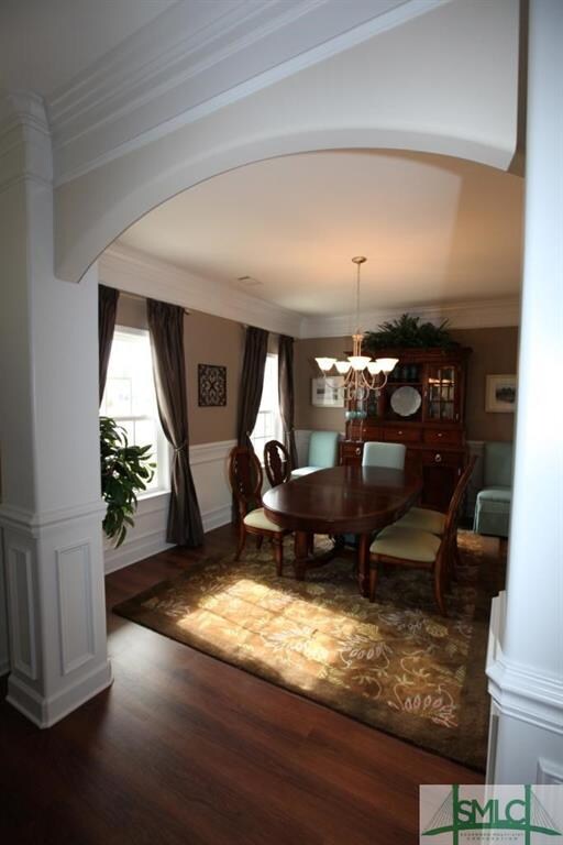 Dining room with beautiful wainscoting and crown m