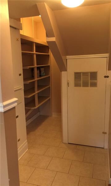 Unit 1- Off of kitchen is a pantry, door to the ba