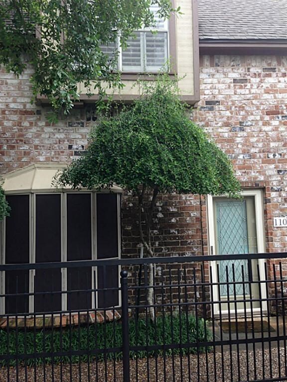 Unit #110 is located by the pool. Notice the storm door.