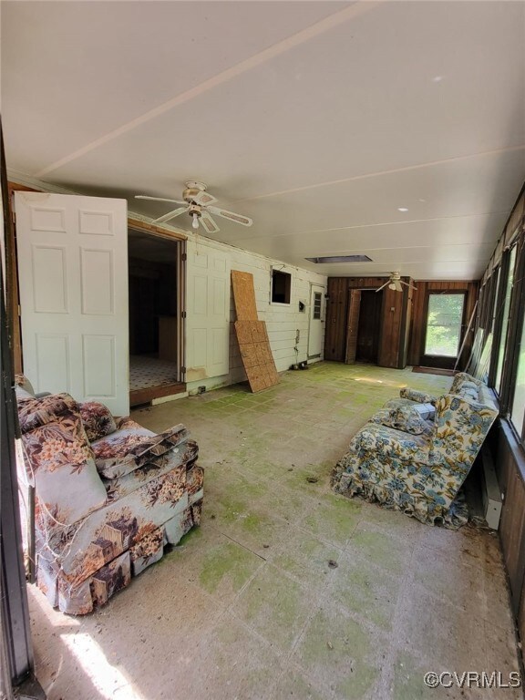 Living room featuring ceiling fan