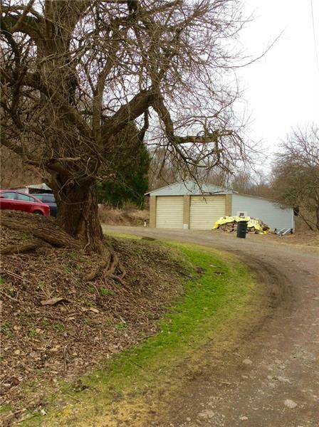 Huge detached garage with 14' doors, loft and addi