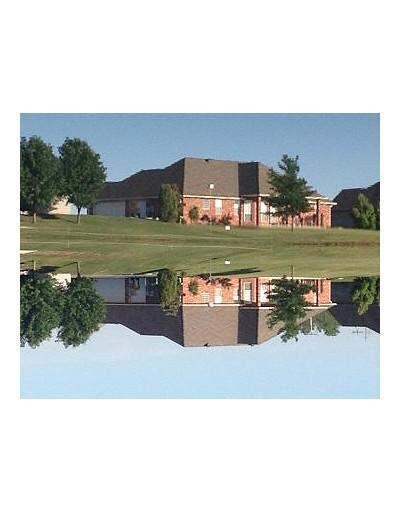 Exterior Back. The view across the lake to the hou