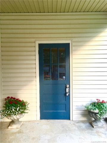 Attached carport storage shed.