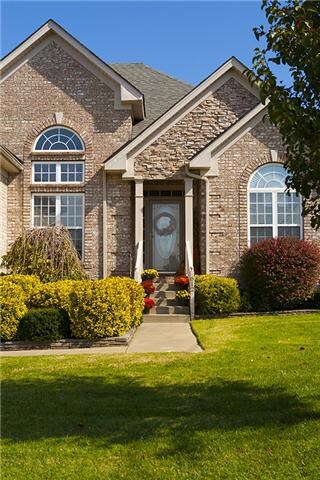 What a beautiful entry to this 3 side brick home.