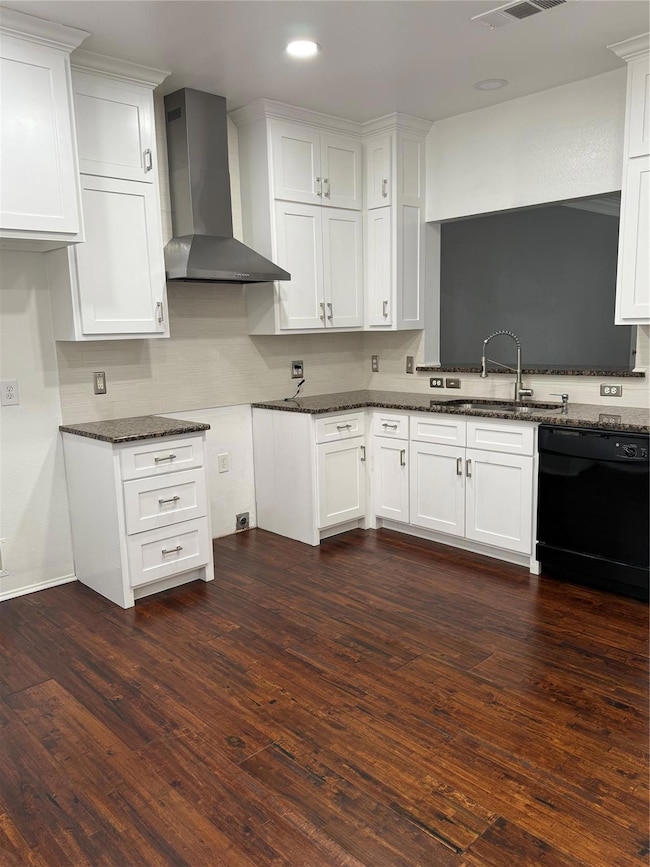 Kitchen featuring ventilation hood, dark wood-type
