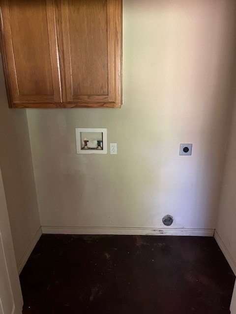 Laundry area with washer hookup, cabinet space, hookup for an electric dryer, and concrete flooring