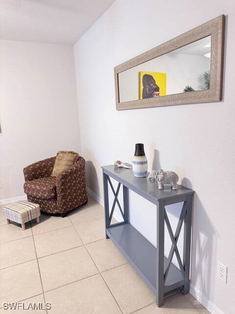 Office featuring baseboards and tile patterned flo