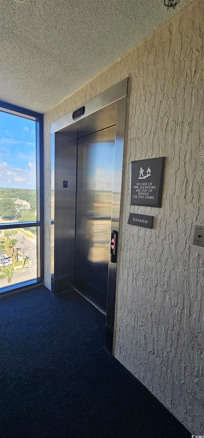 Doorway to property with elevator