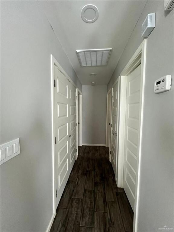 Hall featuring dark hardwood / wood-style floors