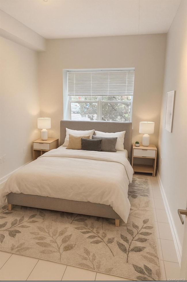 Bedroom featuring tile patterned floors