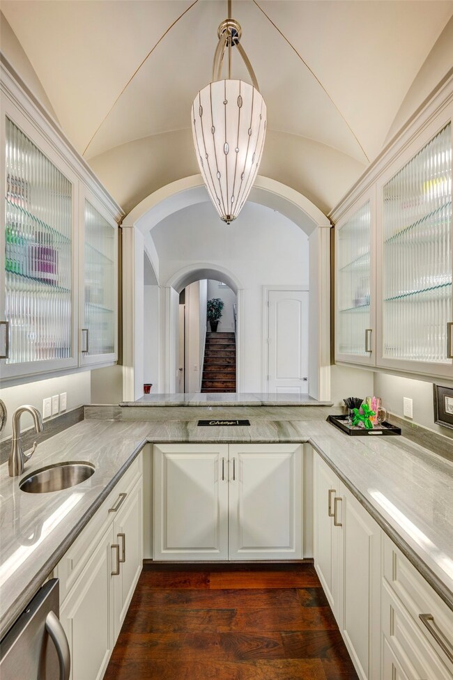 Stunning Wet bar has custom design, ice maker, bev