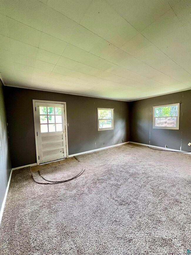Empty room featuring carpet floors