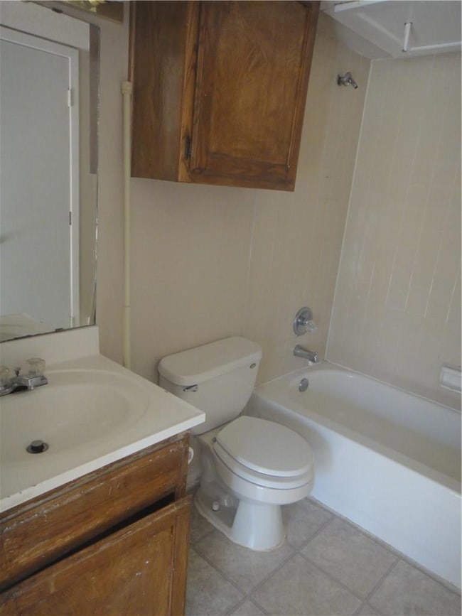 Bathroom featuring vanity, tile patterned floors, 