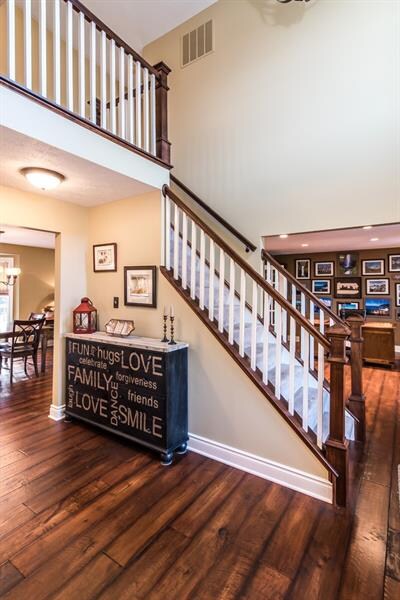 The updates throughout are noticeable as soon as you walk in! The 2 story entry features a new Craftsman inspired railing, new wide plank, hand scraped hardwood floors  and new light fixture.