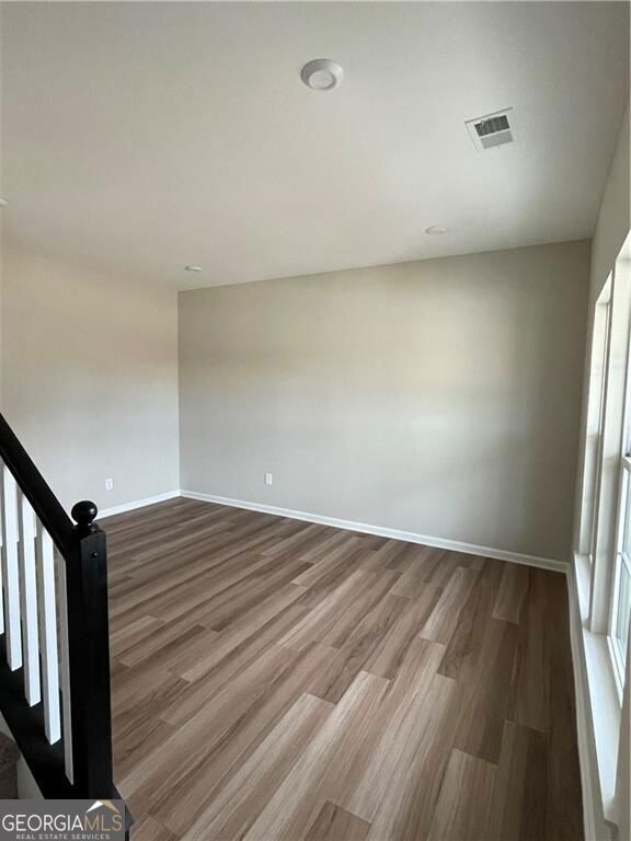 To right of steps off of foyer
