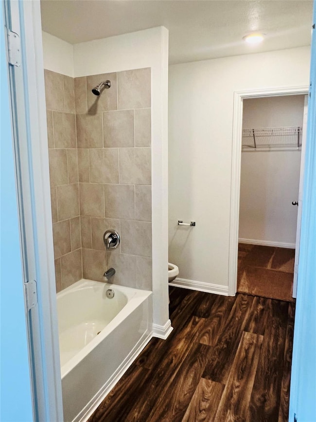 Bathroom with wood finished floors, shower / wash