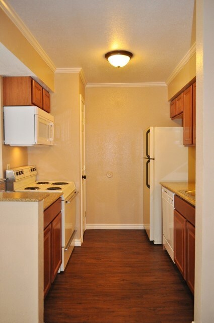 Kitchen featuring light countertops, white applian