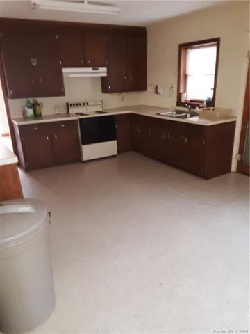 kitchen with stove and sink.