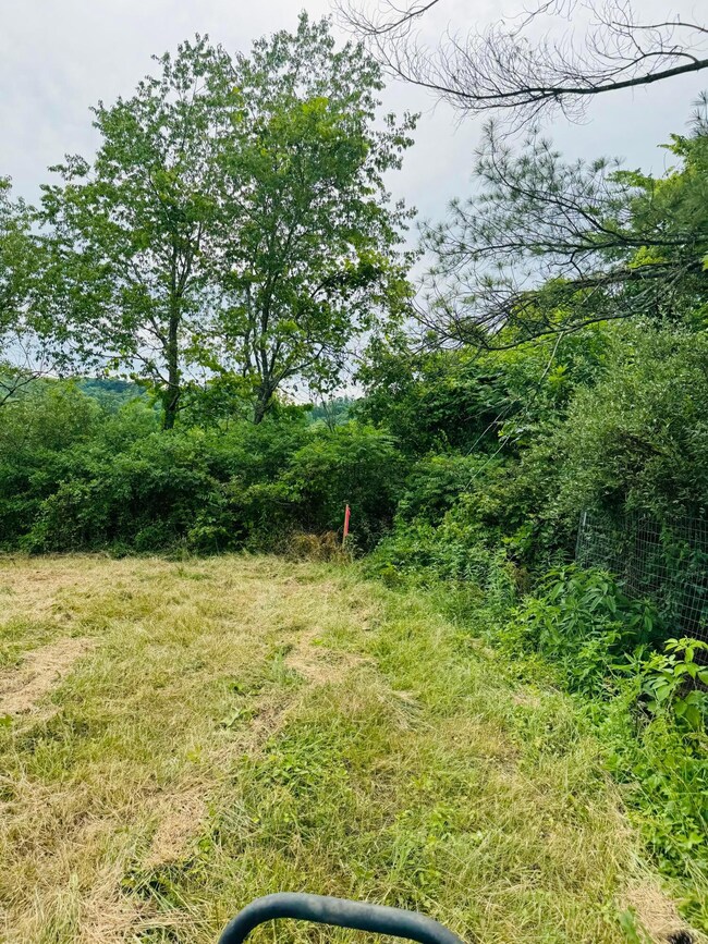 marker at front of tract 2 to right as y