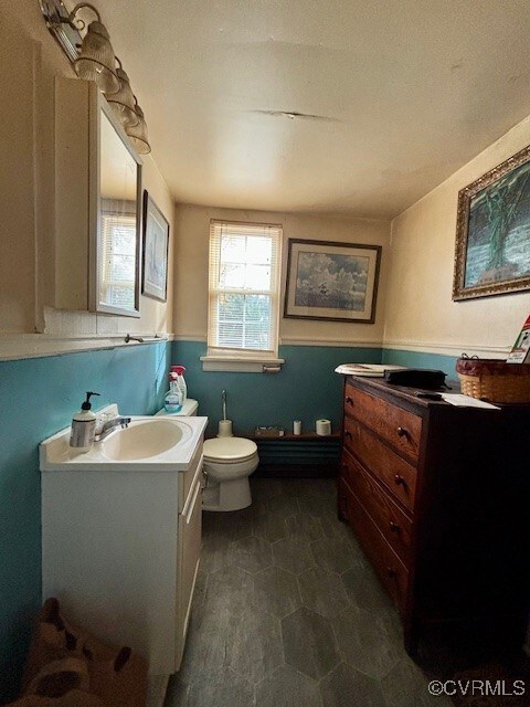 Bathroom with vanity and toilet