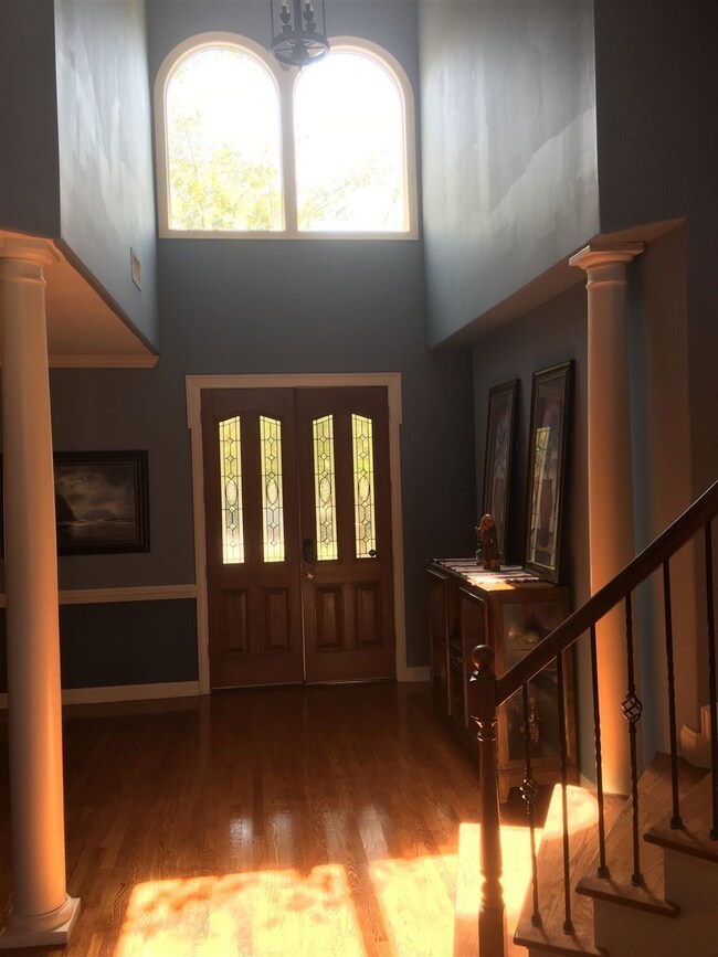 Entry consists of double doors & hardwood througho
