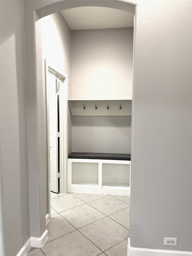 To the right of the entry is a convenient drop off station near the garage.