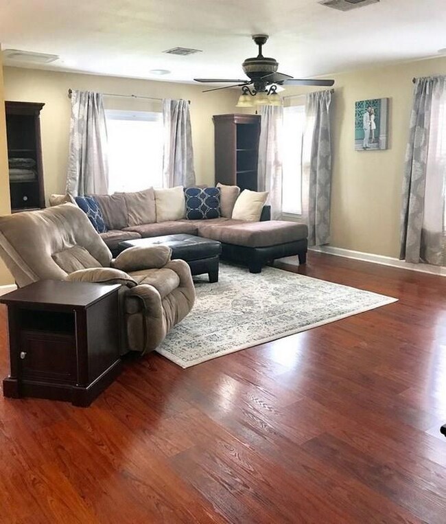Family room with wood laminate floors lots of ligh