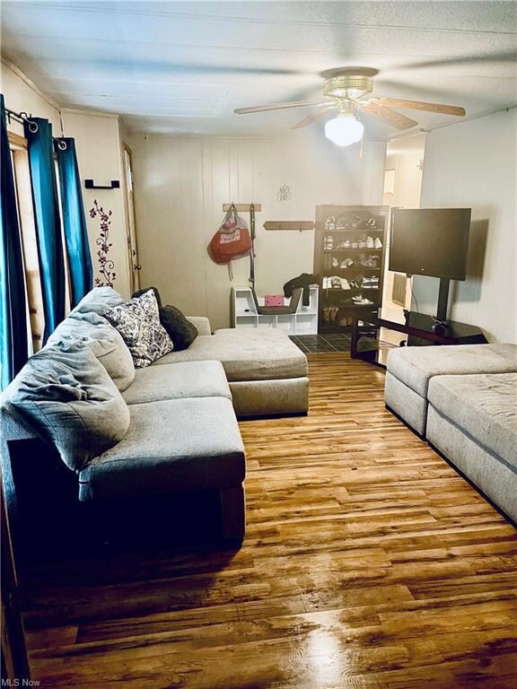 Hardwood floored living room featuring a textured 