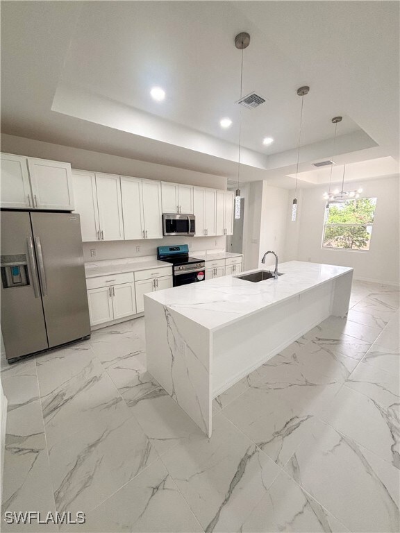 Kitchen with appliances with stainless steel finis