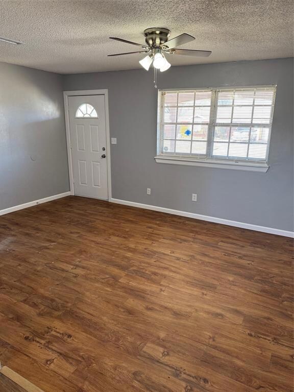 Entryway featuring ceiling fan, a textured ceiling