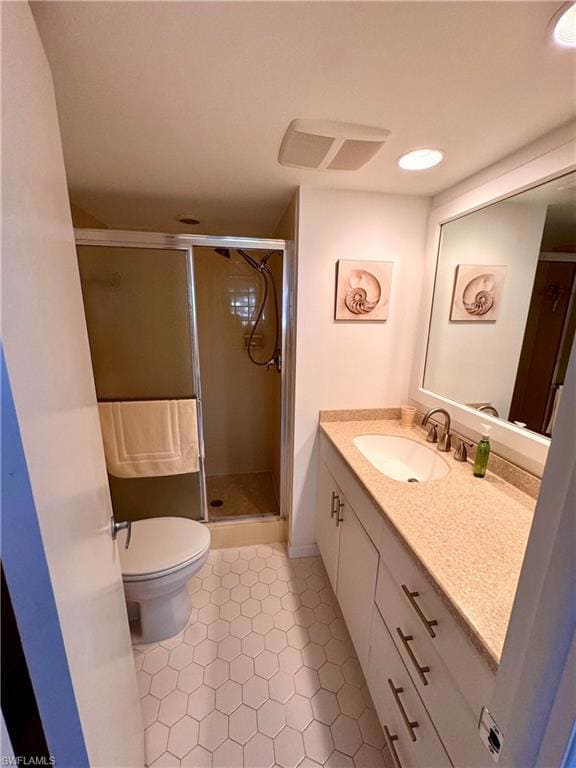 Full bathroom with vanity, a shower stall, light tile patterned flooring, and recessed lighting