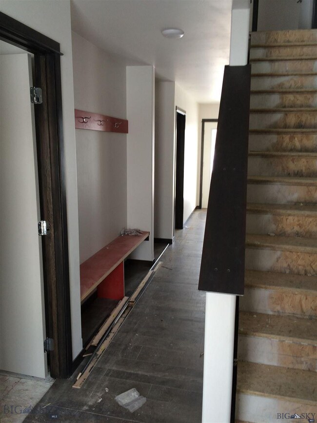 downstairs hall/bench & coat hanging area.