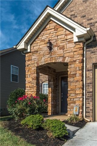 Stone entrance adds visual appeal, style and cover